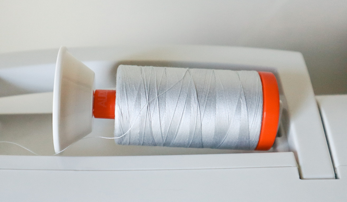 How to Wind and Insert a Bobbin into a Singer Tradition Sewing Machine Hailey Stitches