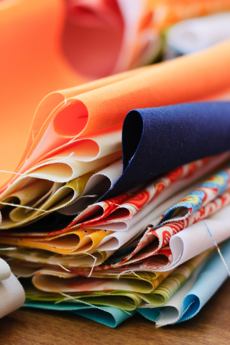 Colorful fabric folded in a stack.